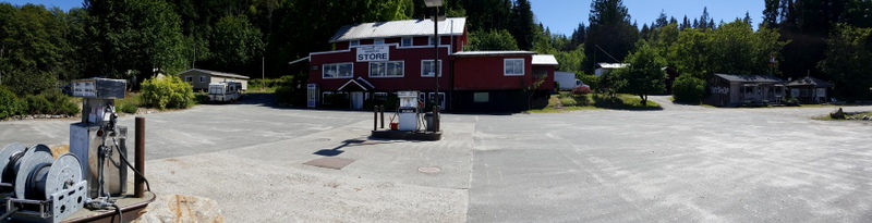 Squirrel Cove Store and two fuel pumps. Restaurant is to the right.